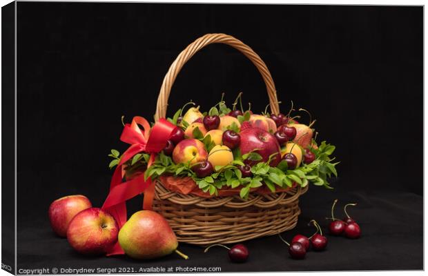 Basket with fresh fruits and berries on a black background Canvas Print by Dobrydnev Sergei