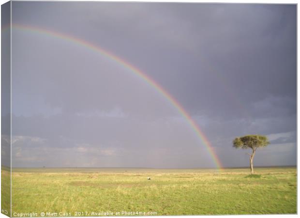 Photo of a rainbow over the plains of the Masai Ma Canvas Print by Matt Cass