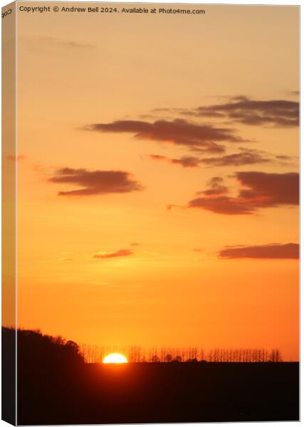 Clouds and silhouettes sunset Canvas Print by Andrew Bell