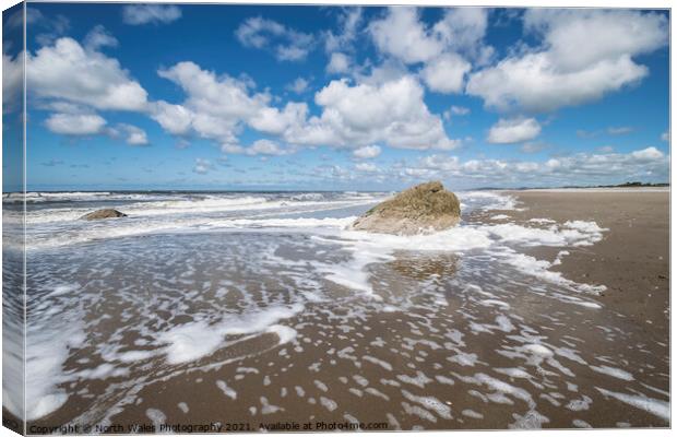 Foaming sea and fluffy clouds Canvas Print by North Wales Photography