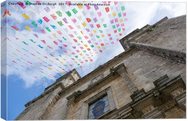 Flags flying at a Hispanic Church Canvas Print by Stephen Dryburgh