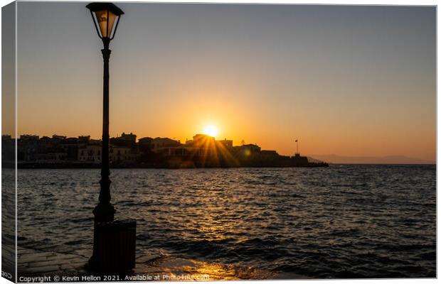 Sun setting over the Venetian Harbour, Chania Canvas Print by Kevin Hellon