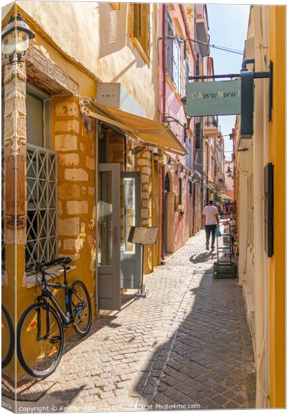Narrow sreet in old Chania Canvas Print by Kevin Hellon