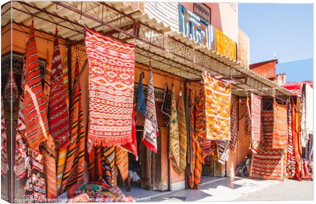 Carpets hanging outside a shop Canvas Print by Kevin Hellon
