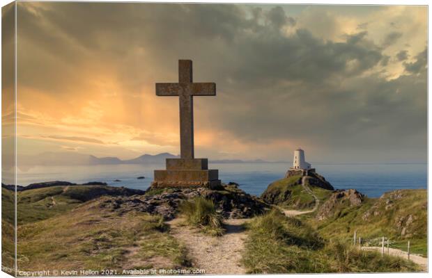 St Dwynwen’s Cross and Tyr Mawr lighthouse at sunset,  Canvas Print by Kevin Hellon