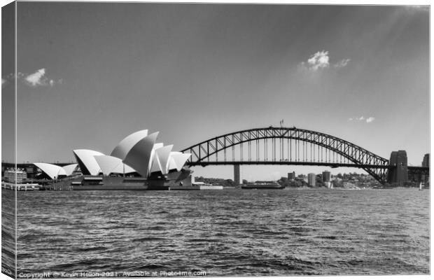 View of the Opera House in Sydney Harbor. The Sydney Harbour Bri Canvas Print by Kevin Hellon