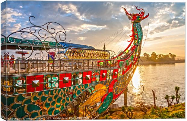 Dragon boat prow at sunset Canvas Print by Kevin Hellon