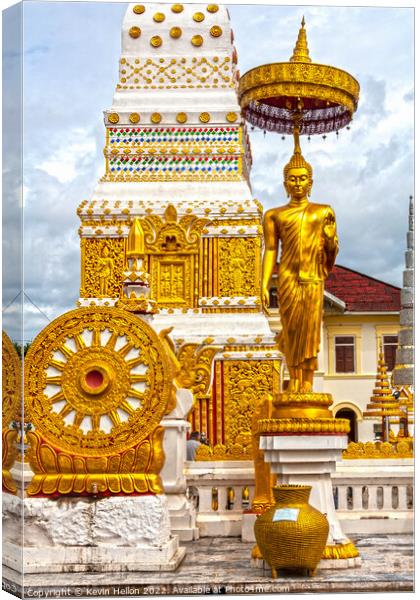 Buddha image and spire, Wat Phra That Phanom Canvas Print by Kevin Hellon