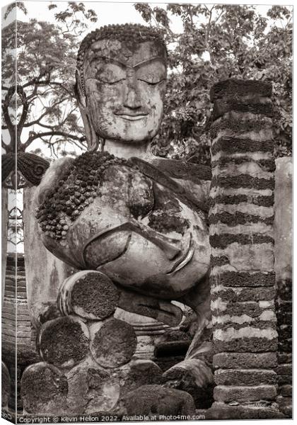Buddha statues in Khamphaeng Phet Historical Park, Thailand Canvas Print by Kevin Hellon