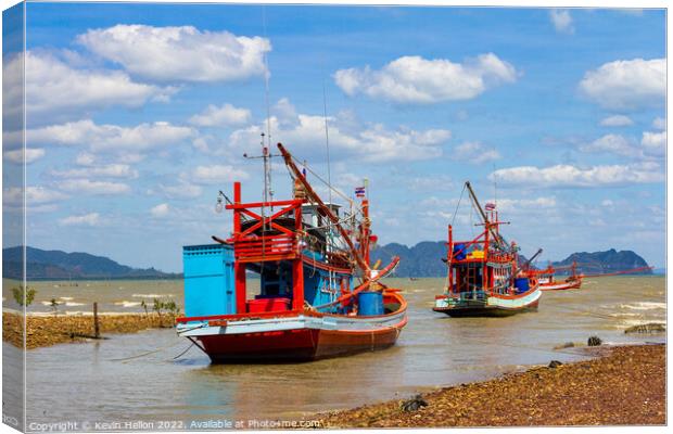 Thai fishing boats anchored in Koh Lanta, Krabi, Thailand Canvas Print by Kevin Hellon