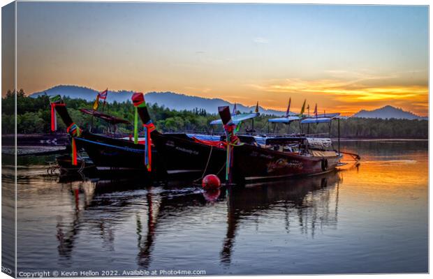 Long tail boats moored in Psk Meng, Trang Province at sunrise. Canvas Print by Kevin Hellon