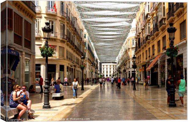 People shopping on Marques de Larios. Canvas Print by Kevin Hellon