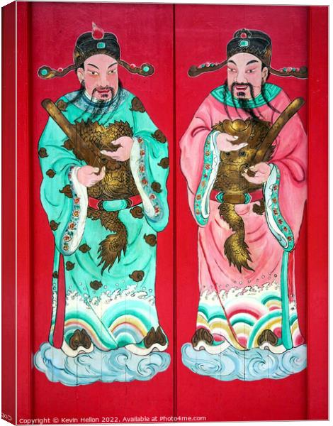 Chinese figures on temple door  Canvas Print by Kevin Hellon