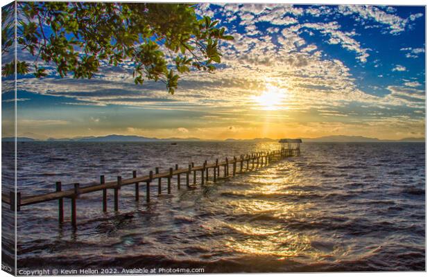 Sunrise over a pier in Phang Nga Bay Canvas Print by Kevin Hellon