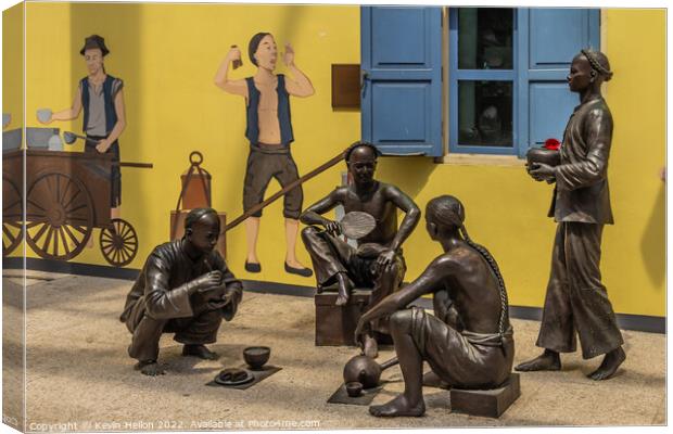 Bronze statues and wall mural, Singapore Canvas Print by Kevin Hellon