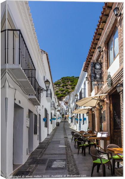 Typical street in Mijas, Andalusia, Spain Canvas Print by Kevin Hellon