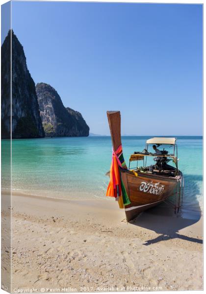 Long tail boat on white sand beach Canvas Print by Kevin Hellon