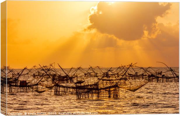 Sun rays from behind a cloud  Canvas Print by Kevin Hellon