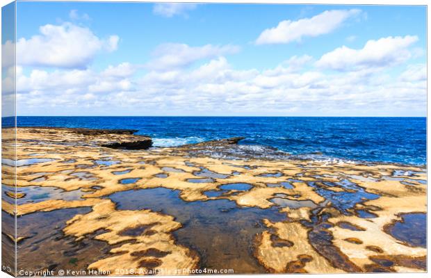 Looking out to sea over the rock pools Canvas Print by Kevin Hellon