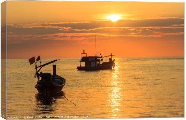 Silhouettes of boats on Bang Tao Beach Canvas Print by Kevin Hellon