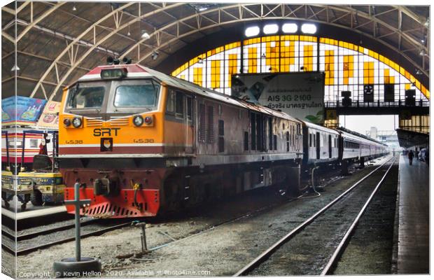 Diesel locomotive with carriages in Hua Lampong  Canvas Print by Kevin Hellon