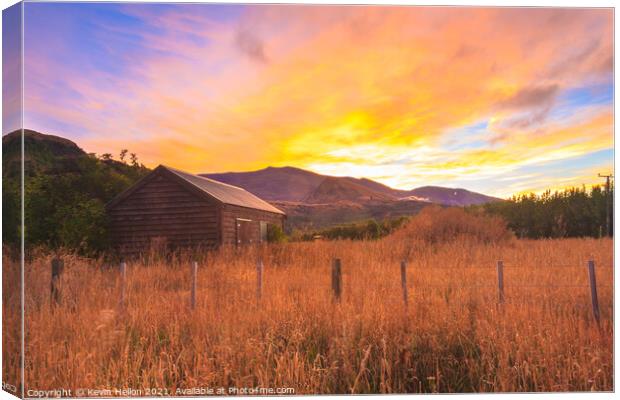 Sunrise over the Crown Mountains Canvas Print by Kevin Hellon