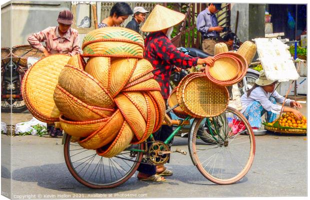 Street vendor on bicycle Canvas Print by Kevin Hellon