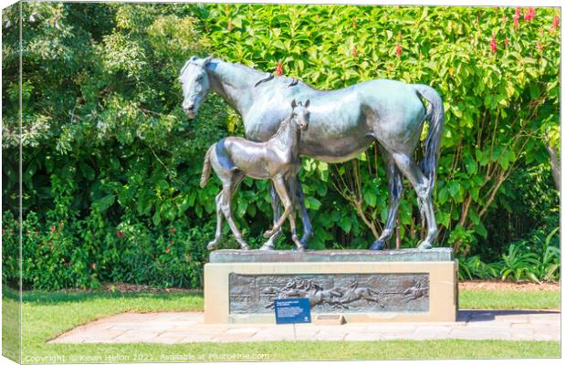 Mare and foal statue. Canvas Print by Kevin Hellon