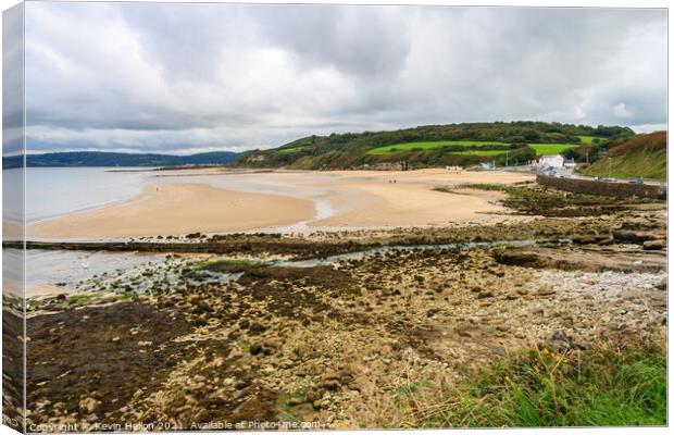 Benllech beach on a cloudy day Canvas Print by Kevin Hellon
