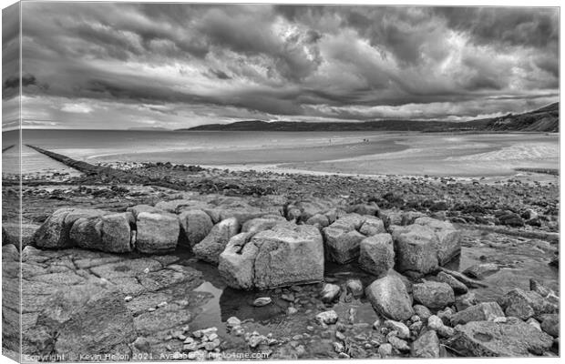 Stormy skies over Benllech Beach Canvas Print by Kevin Hellon