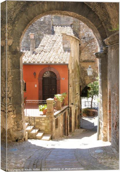 Narrow street in Narni Canvas Print by Kevin Hellon