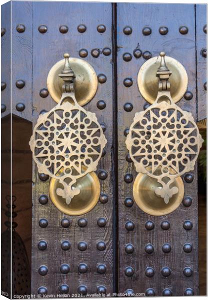 Ornate brass doorknockers Canvas Print by Kevin Hellon