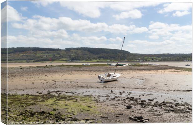 Boats moored in Red Wharf BayAnglesey at low tide. Canvas Print by Kevin Hellon