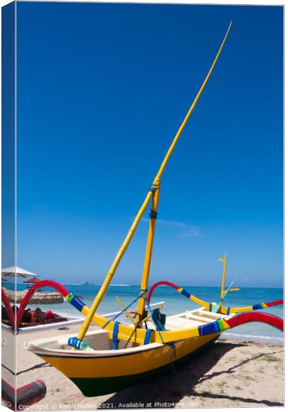 Traditional jukung boat on the beach in Sanur, Bali, Indonesia Canvas Print by Kevin Hellon