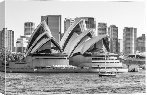 A yacht cruises by the Opera House Canvas Print by Kevin Hellon