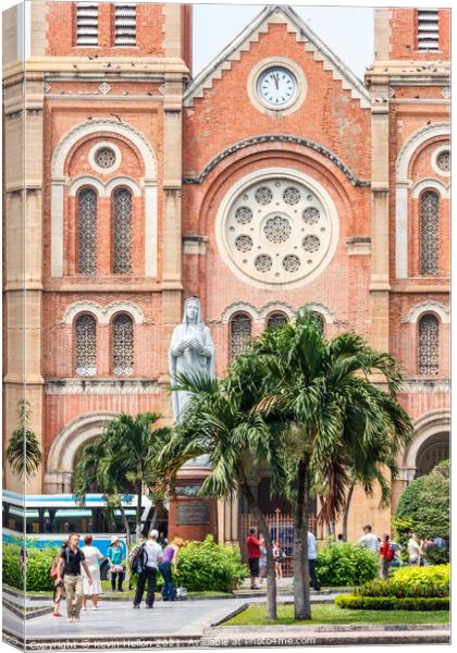  Tourists congregating outside the Notre Dame Basilica. Canvas Print by Kevin Hellon