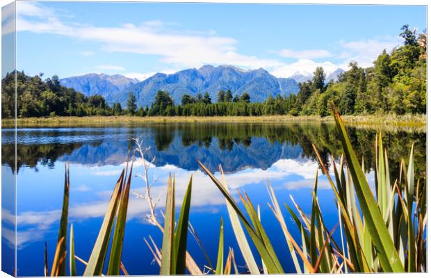Mountain reflections in Lake Matheson Canvas Print by Kevin Hellon