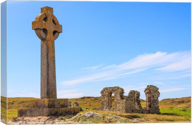 Celtic cross and the remains of St. Dwynwen church Canvas Print by Kevin Hellon