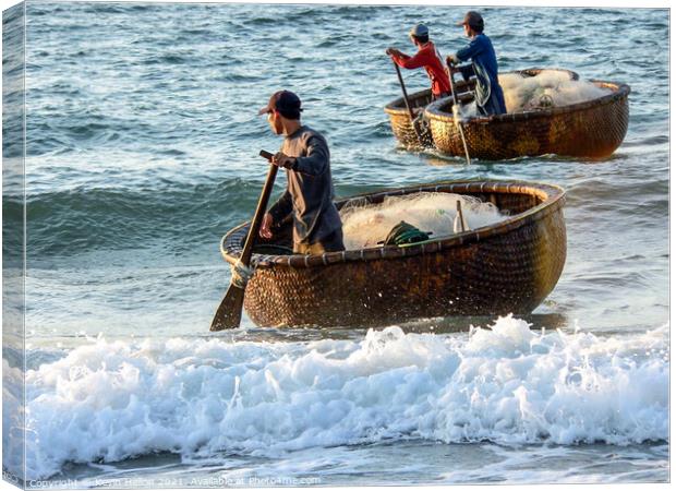 Fishermen returning in their coracles Canvas Print by Kevin Hellon