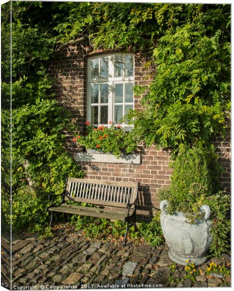 old farm with green plants on the wall Canvas Print by Chris Willemsen