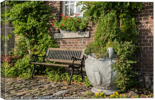 old farm with green plants on the wall Canvas Print by Chris Willemsen