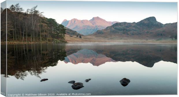 Beautiful Autumn Fall colorful sunrise over Blea Tarn in the Lake District with High Raise and The Langdales in the distance Canvas Print by Matthew Gibson