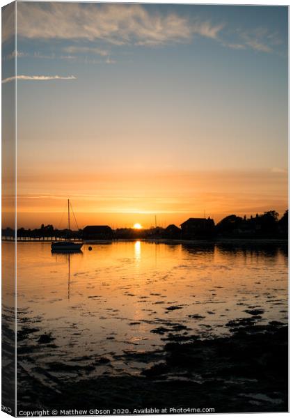 Beautiful Summer sunset landscape over low tide harbor with moored boats Canvas Print by Matthew Gibson
