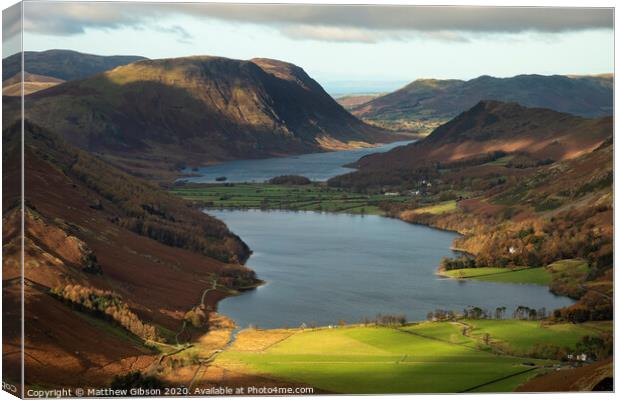 Majestic vibrant Autumn Fall landscape of Buttermere and Crummock Water flanked by mountain peaks of Haystacks High Stile and Mellbreak in Lake District Canvas Print by Matthew Gibson