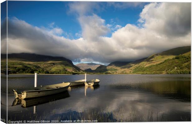 Landscape image of rowing boats on Llyn Nantlle in Snowdonia at sunset Canvas Print by Matthew Gibson