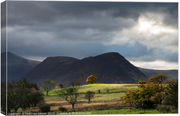 Beautiful Autumn Fall landscape view along valley towards Mellbreak and Grasmoor in Lake District with vibrant epic lighting in late afternoon Canvas Print by Matthew Gibson