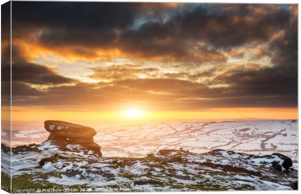 Stunning Winter sunset over snow covered Winter landscape in Peak District Canvas Print by Matthew Gibson