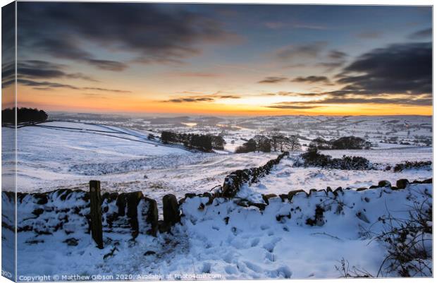 Stunning Winter sunset over snow covered Winter landscape in Peak District Canvas Print by Matthew Gibson