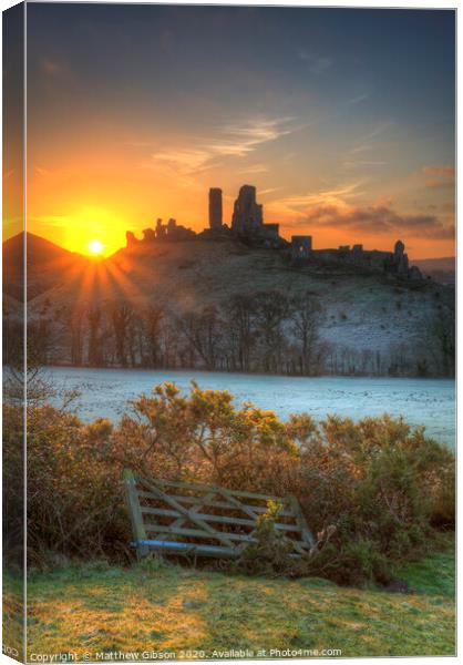 Beautiful Medieval castle ruin in countryside landscape during Winter sunrise Canvas Print by Matthew Gibson