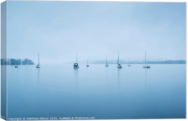 Foggy morning landscape over Lake Windermere in Lake District in Autumn Canvas Print by Matthew Gibson